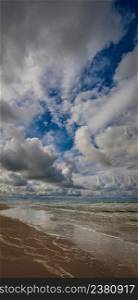 Baltic sea beach, midday. The cloudy sky, Baltic sea coastline. Lithuania.