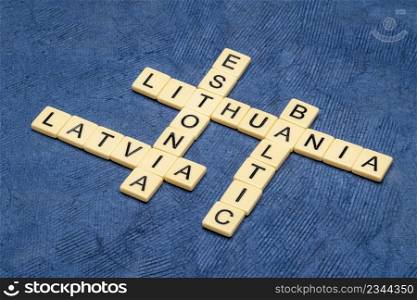 Baltic states, Latvia, Estonia and Lithuania, crossword in ivory letter tiles against textured handmade paper