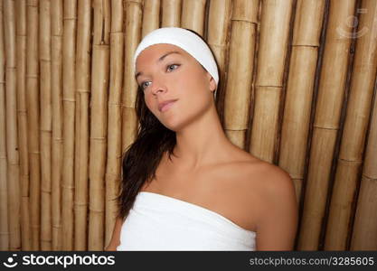 bamboo spa woman sitting relaxed after massage treatment