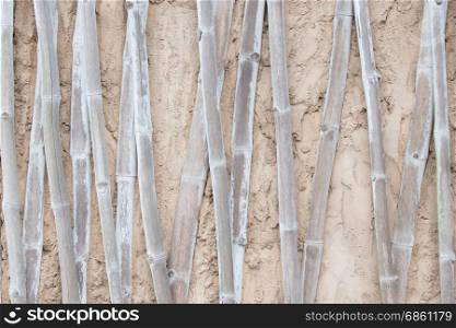 Bamboo texture in poured concrete wall, old african house