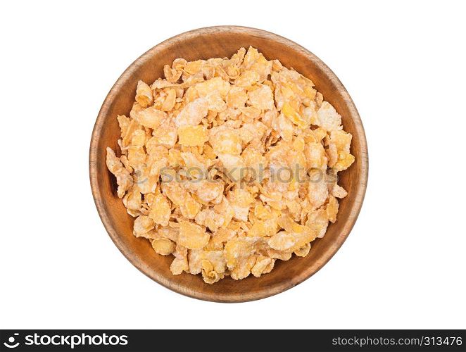 Bamboo wood bowl with natural organic granola cereal corn flakes on white.Top view