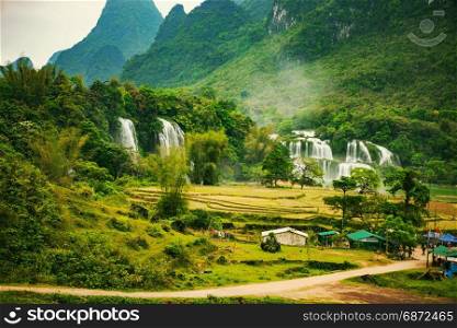 Ban Gioc waterfall in Cao Bang, Viet Nam - The waterfalls are located in an area of mature karst formations were the original limestone bedrock layers are being eroded