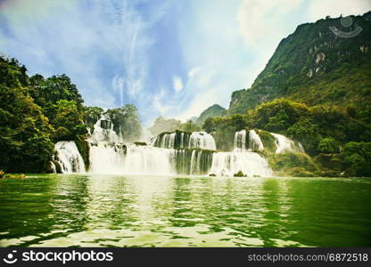 Ban Gioc waterfall in Cao Bang, Viet Nam - The waterfalls are located in an area of mature karst formations were the original limestone bedrock layers are being eroded