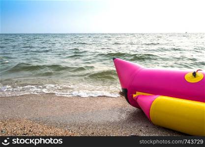 Banana Boat on the beach with sand,sea and blue sky