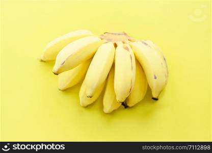 banana bunch on yellow background fresh and healthy fruit