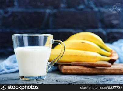 banana milk in glass and on a table