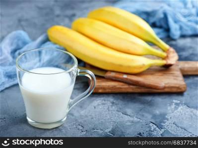 banana milk in glass and on a table