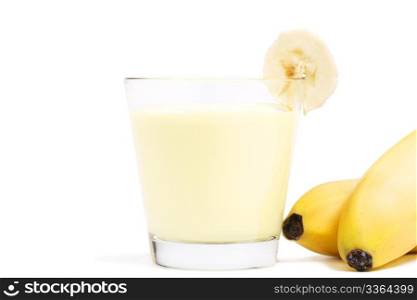 banana milkshake with a piece of banana and bananas aside. banana milkshake with a piece of banana and bananas aside on white background