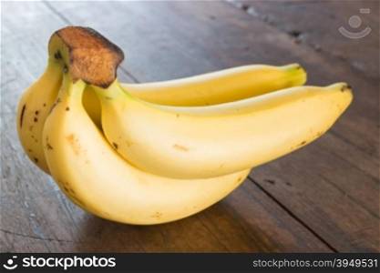 Banana on brown wooden background, stock photo