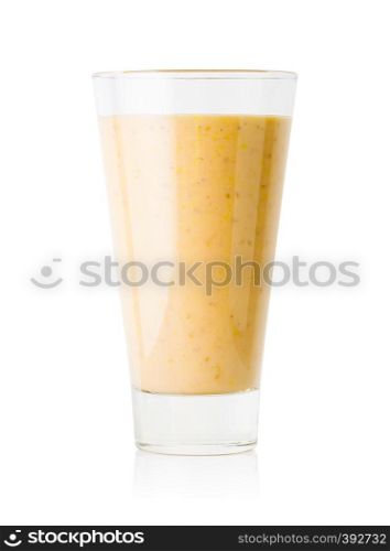 Banana or vanilla smoothie or yogurt in a tall glass isolated on white background. Banana or vanilla smoothie or yogurt in tall glass