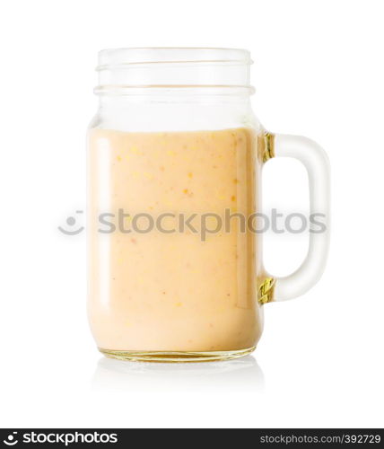 Banana or vanilla smoothie or yogurt in mason jar isolated on white background. Banana or vanilla smoothie or yogurt in mason jar