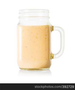 Banana or vanilla smoothie or yogurt in mason jar isolated on white background. Banana or vanilla smoothie or yogurt in mason jar