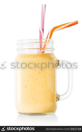 Banana or vanilla smoothie or yogurt in mason jar with straws isolated on white background. Banana or vanilla smoothie or yogurt in mason jar with straws