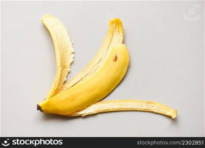 banana peel on grey background, Ripe banana peel on floor - top view