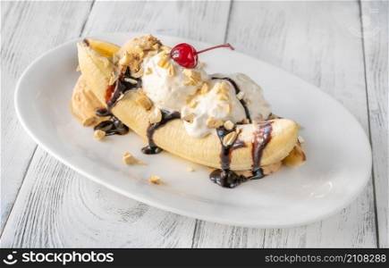 Banana split - American ice-cream based dessert on the serving plate