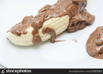 banana with chocolate on a white background