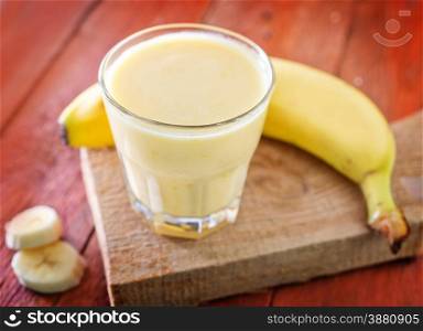 banana yogurt in glass and on a table