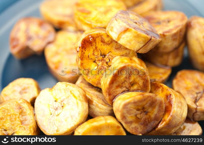 bananas in caramel lying on a plate