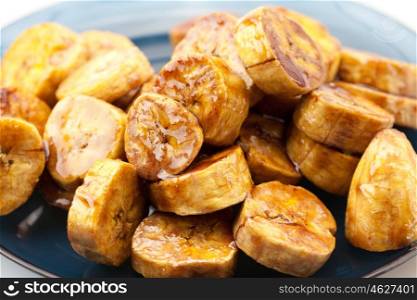 bananas in caramel lying on a plate