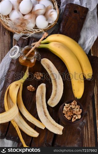 Bananas, nuts, eggs, honey - Ingredients for baking homemade banana bread
