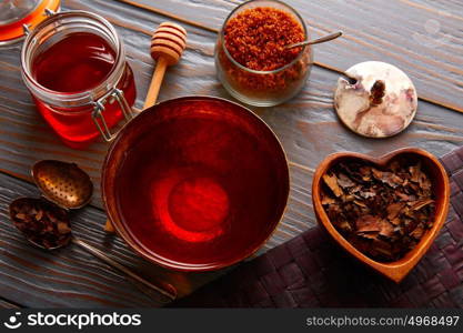 Bancha tea served in golden bowl on wooden table board