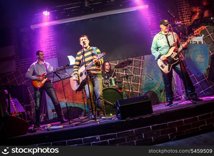 Band performs on stage, rock music concert