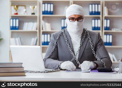 Bandaged businessman worker working in the office doing paperwor. Bandaged businessman worker working in the office doing paperwork