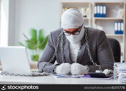 Bandaged businessman worker working in the office doing paperwor. Bandaged businessman worker working in the office doing paperwork