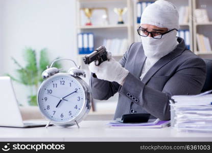 Bandaged businessman worker working in the office doing paperwor. Bandaged businessman worker working in the office doing paperwork