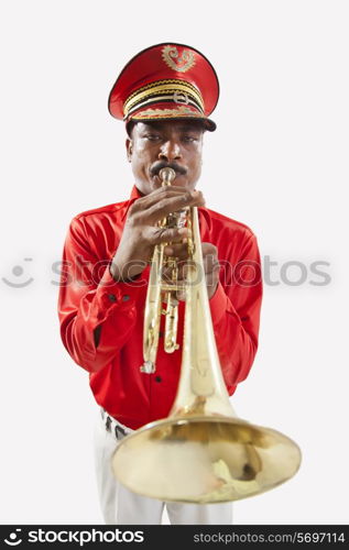 Bandmaster playing on a trumpet