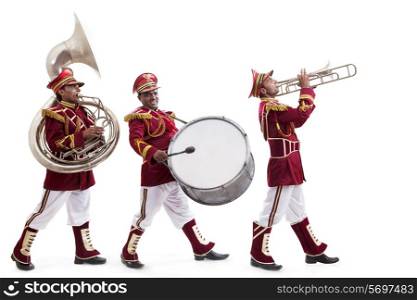 Bandwalas with instruments marching