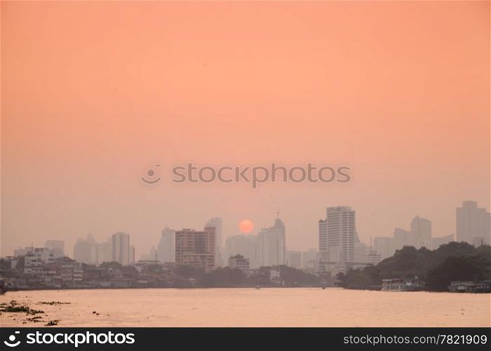 Bangkok city in morning.Tallest building in town And the river through the city. Sun rising in the morning.