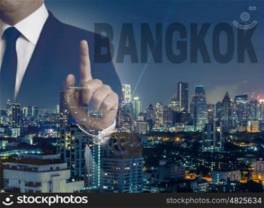 Bangkok skyline at night with businessman concept . Bangkok skyline at night with businessman concept.