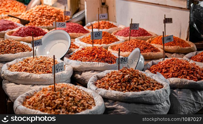 Bangkok Street vendor sells dried seafood and dried shrimp both retail and whole sale in Tha tian local market