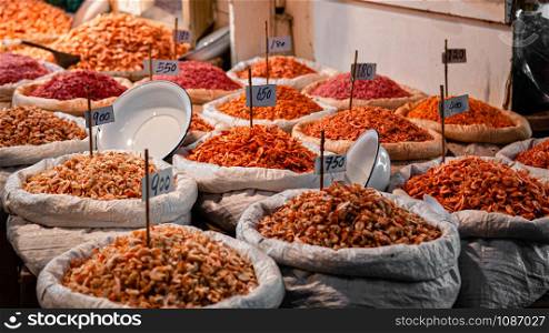Bangkok Street vendor sells dried seafood and dried shrimp both retail and whole sale in Tha tian local market