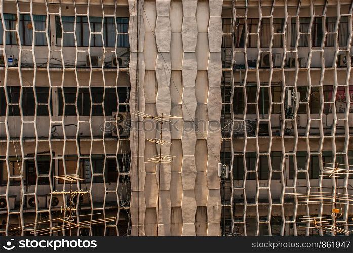 Bangkok, Thailand - 02 Aug 2019 : architectural background texture pattern of Buildings with windows.