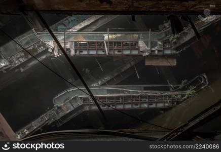Bangkok, Thailand - 07 Feb 2022 : Damaged escalators in abandoned shopping mall building. Structural and ruins was left to deteriorate over time, New World Mall, Selective focus.