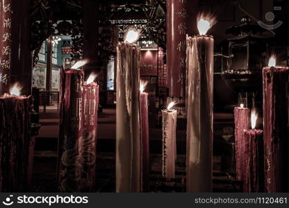 Bangkok, Thailand - 13 Dec 2019 : Votive candle at Kuan yim shrine (Thian Fa Foundation) a Traditional Chinese temple at Yaowarat Road In The Night.