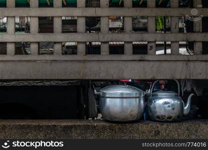 Bangkok, Thailand - 29 June, 2019: Antique pots and kettles are located on the nook of the Klong Toey road in Bangkok.