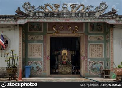 Bangkok, Thailand - Apr 29, 2022 : Architecture exterior in front of Traditional chinese shrine (Thai characters is Phutthamonthon Sathan). Selective focus.