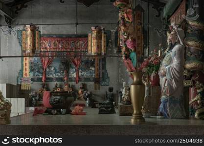 Bangkok, Thailand - Apr 29, 2022   Architecture interior of Traditional chinese shrine and Chinese god statues on Chinese altar table at Phutthamonthon sathan or Sun wukong shrine. Selective focus.