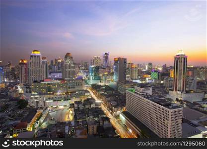 BANGKOK THAILAND - APRIL21 : beautiful sunset sky and building lighting at ratchaprarop road in heart of bangkok business center on april 21 , 2015 in bangkok thailand