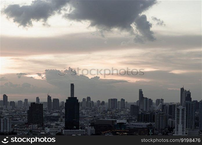 Bangkok, Thailand - Aug 14, 2022 - Gorgeous scenic of the sunset with cloud on the sky over large metropolitan city in Bangkok. Nice city view, Space for text, No focus, specifically.