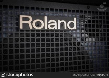 BANGKOK, THAILAND - AUGUST 6 : Roland Logo on Keyboard Power Amplifier as vintage background music theme, Bangkok, Thailand on 6 August 2015