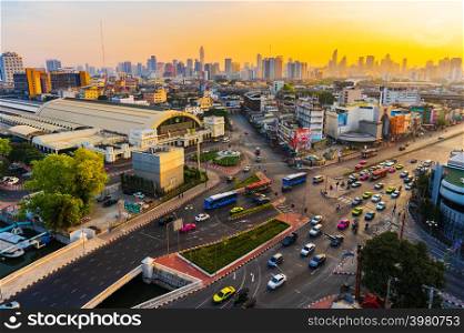 BANGKOK, THAILAND-Dec 2, 2018: traffic at Hua Lamphong intersection and Hua Lamphong railway station with sunrise in Bangkok, Thailand