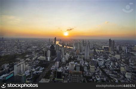 Bangkok, Thailand - December 3, 2018: Beautiful cityscape with sunset and twilight night aerial view of Bangkok. Taking from Mahanakhon Tower Famous skyscrapers of Bangkok.