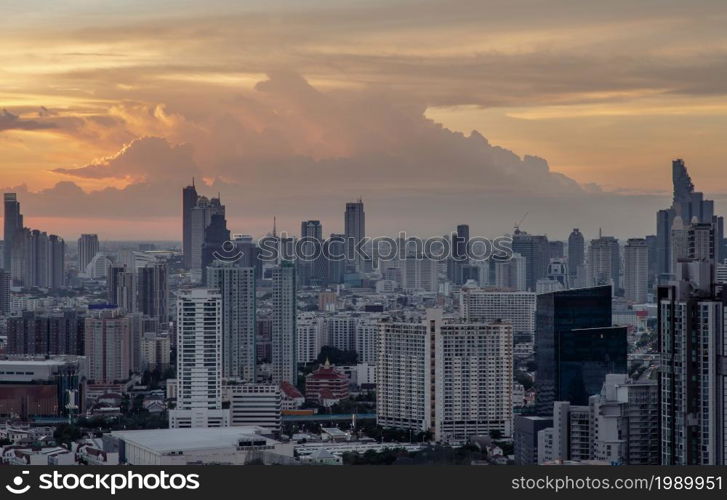 Bangkok, Thailand - Jul 04, 2021: Aerial view of Beautiful scenery view of Skyscraper Evening time Sunset creates relaxing feeling for the rest of the day. Selective focus.