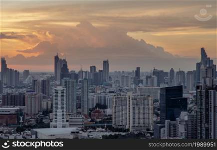 Bangkok, Thailand - Jul 04, 2021: Aerial view of Beautiful scenery view of Skyscraper Evening time Sunset creates relaxing feeling for the rest of the day. Selective focus.