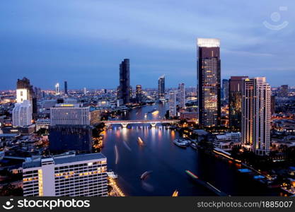 Bangkok THAILAND - July 11 2020 : View landscape of Bangkok tower with river in the evening, downtown and cityscape in twilight at Thailand, skyscraper and condominium.