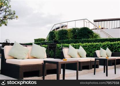 BANGKOK, THAILAND, JULY 25, 2015: Restaurant couch bar with view of Bangkok Cityscape at the Three Sixty Lounge of Millennium Hilton Bangkok Hotel in Bangkok, Thailand.
